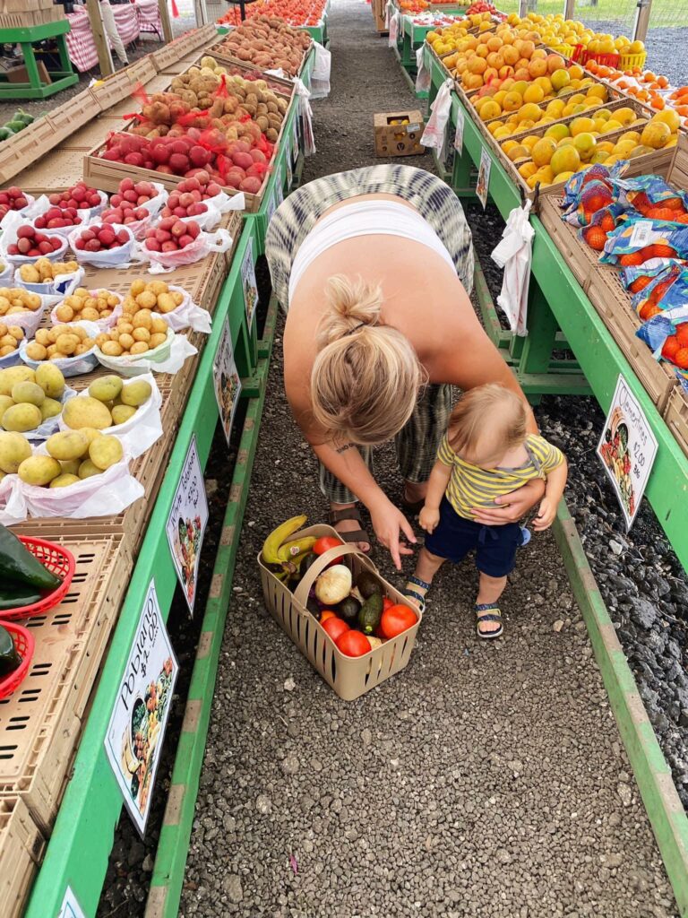 Lily Venable at the produce market with her son