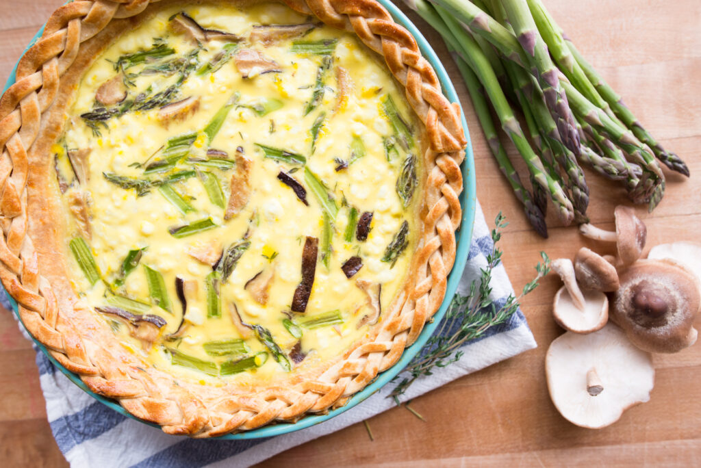 Quiche with braided crust and asparagus and mushrooms 