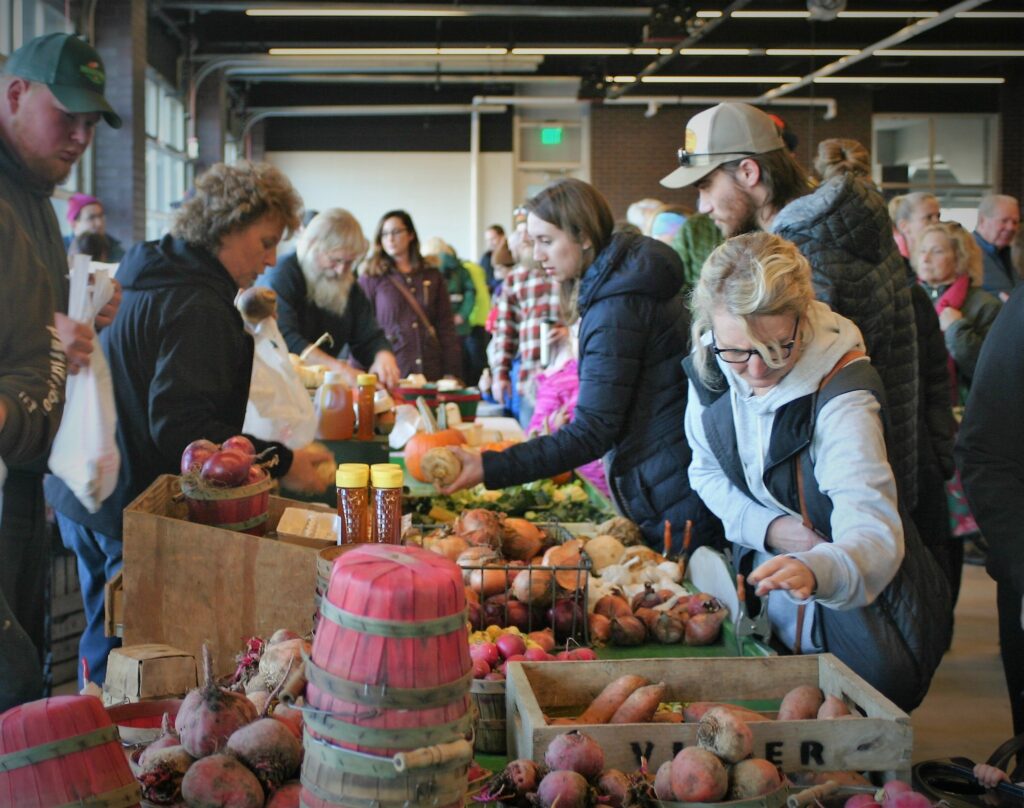 Shoppers peruse local produce at the Holland Farmers Market
