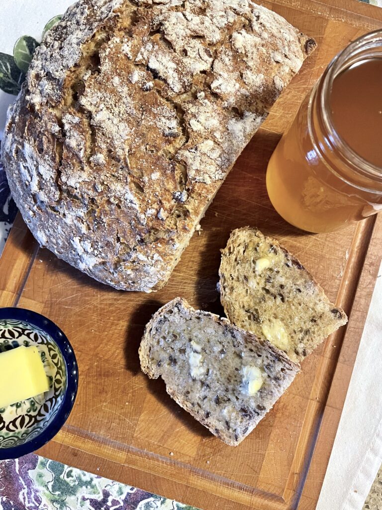 Multigrain bread with a jar of honey and butter